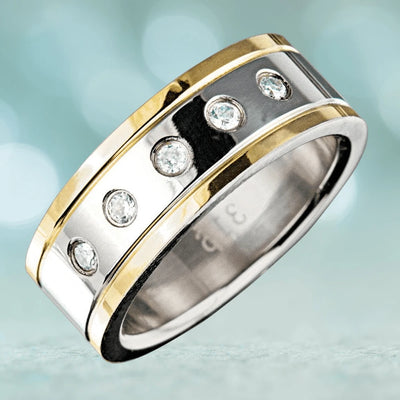 Manhattan Men's Ring featuring a two-tone stainless steel band with gold plating and five inset clear gemstones, designed for a sophisticated male jewelry collection.
