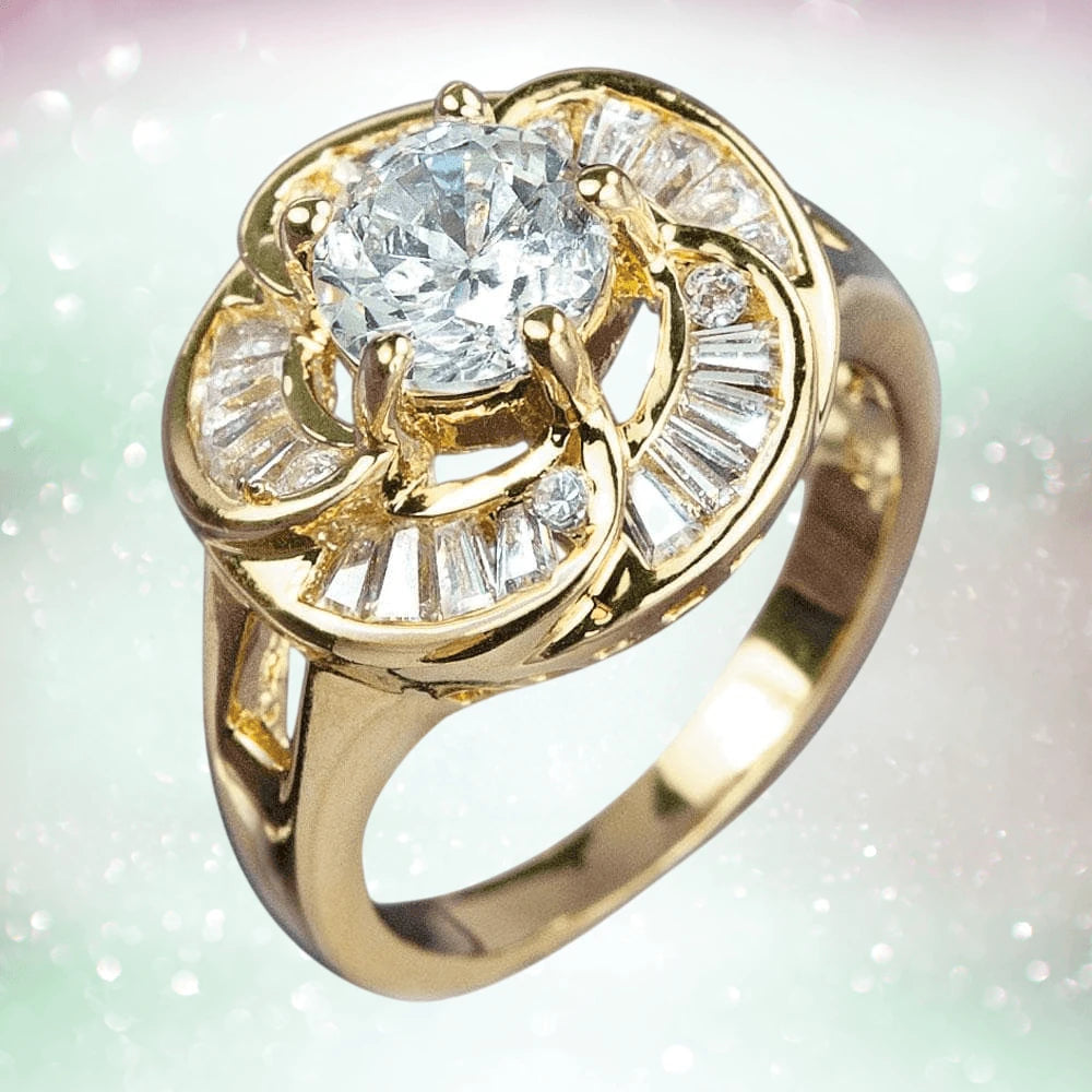Rose Gold Ring featuring a sterling silver base with gold plating, adorned with a large central gemstone and surrounded by smaller baguette and round stones, designed for women.