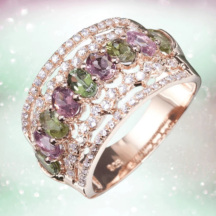 Aurora Ring in sterling silver with rose gold plating, featuring alternating green and purple gemstones surrounded by sparkling clear crystals, designed for women’s jewelry.