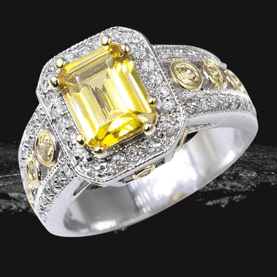Imperial Saffron Ring featuring a two-tone sterling silver band with a large rectangular yellow gemstone centerpiece surrounded by smaller clear and yellow stones for a luxurious look.