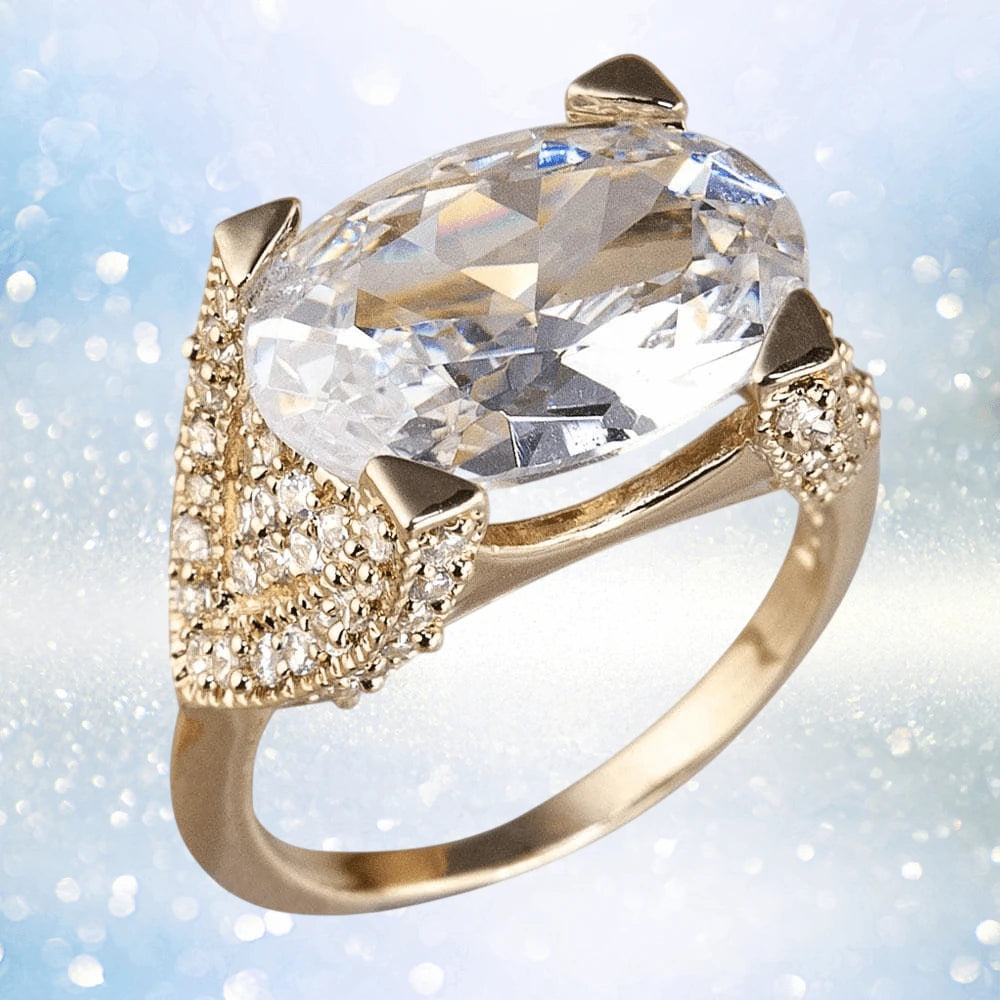 Mustique Ring featuring a large clear gemstone set in sterling silver with gold plating, designed for women, showcasing elegant intricate detailing and sparkling accents.