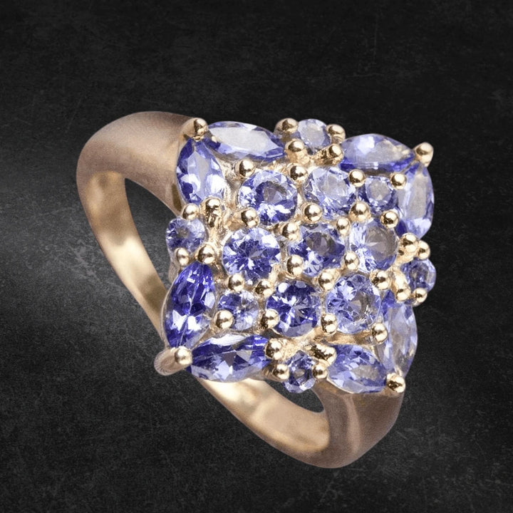 Marquise Tanzanite Ring featuring multiple tanzanite gemstones set on a sterling silver band with gold plating, designed for women’s elegant jewelry collection.