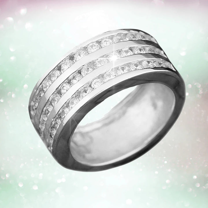 Galaxy Ring Rhodium crafted from sterling silver with rhodium plating, featuring three rows of sparkling stones, designed as a unisex jewelry ring.