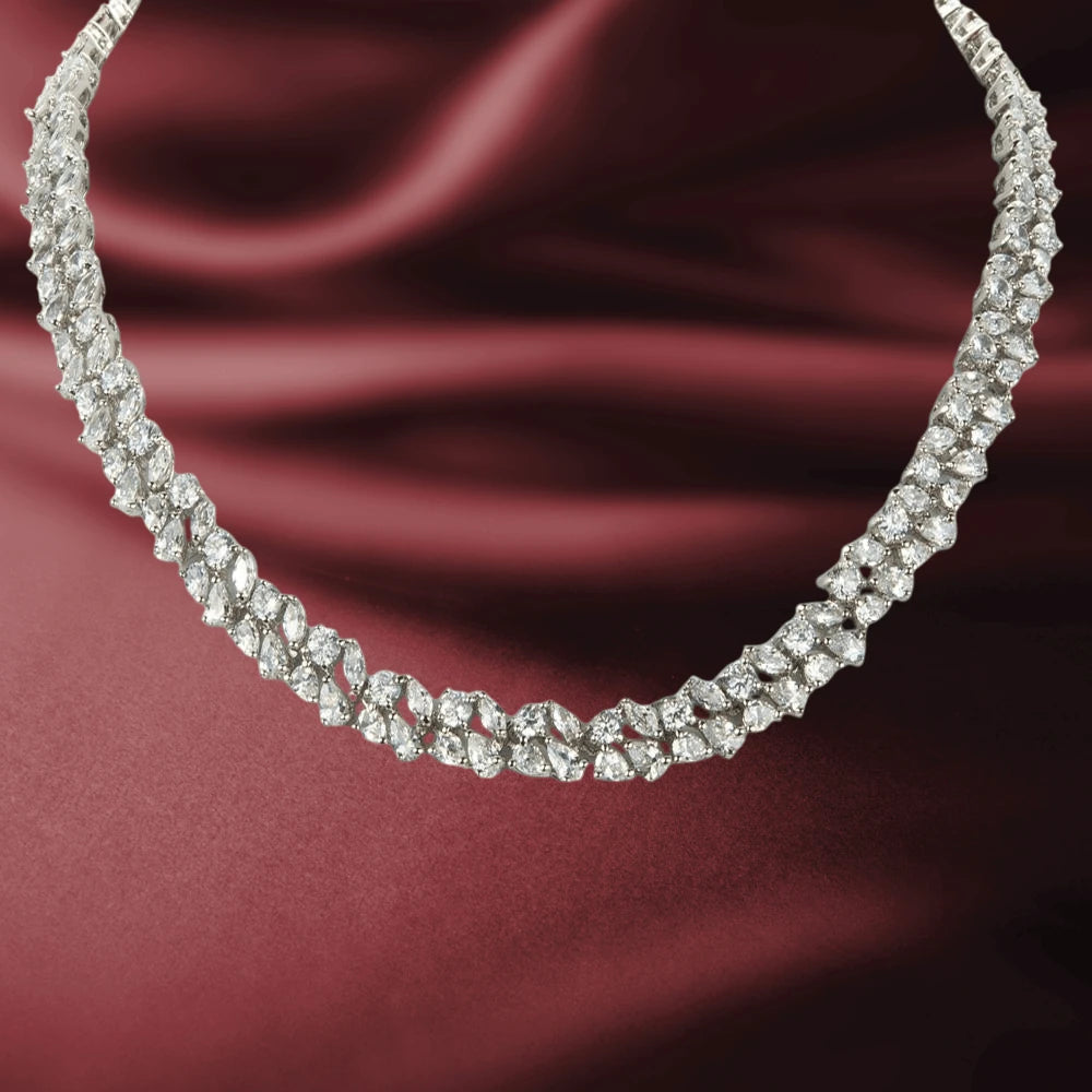 Versailles Necklace featuring sparkling white base metal stones with gold plating, designed elegantly for female jewelry enthusiasts.
