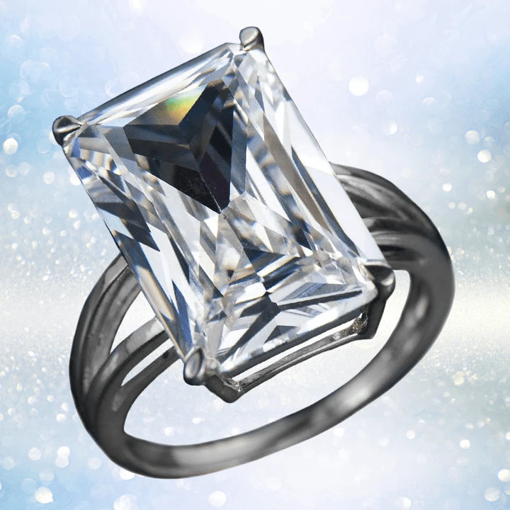 Trillionaire Rhodium Ring featuring a large rectangular-cut clear gemstone set in a sterling silver band with rhodium plating, designed for a female jewelry collection.