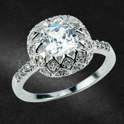 Tangier Ring featuring a sterling silver band with rhodium plating, adorned with a large central gemstone surrounded by intricate smaller stones, designed for women’s jewelry.