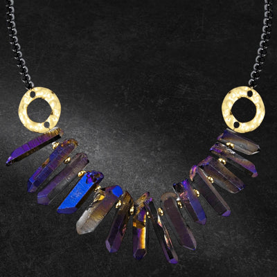 Hematite Crystal Necklace with iridescent crystal gems hanging from a white base metal chain designed for female jewelry, featuring hammered gold-tone circular accents.