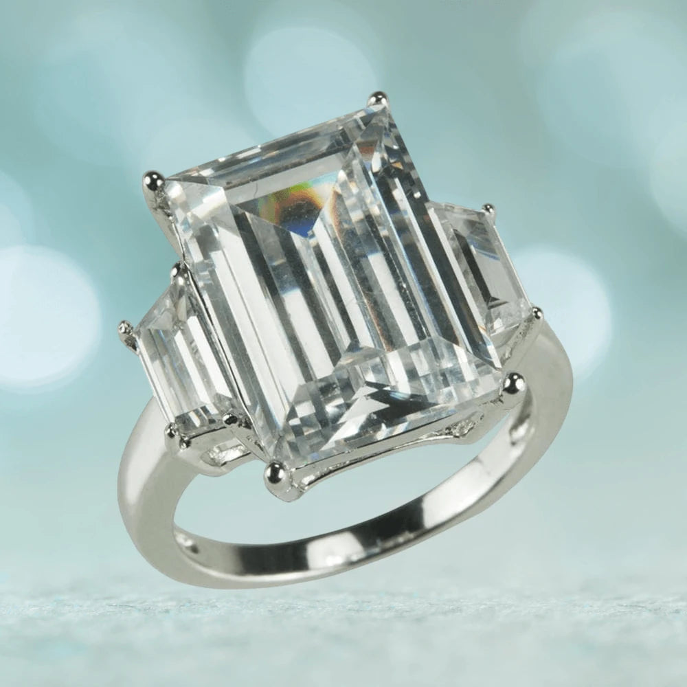 Casino Ring featuring a large emerald-cut clear gemstone set in sterling silver with rhodium plating, designed for female jewelry enthusiasts.