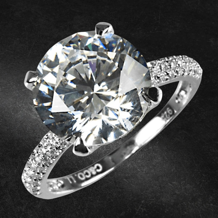 Supernova Ring featuring a large sparkling center stone set in sterling silver with rhodium plating, designed for women’s elegant jewelry collections.