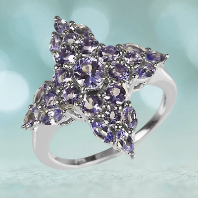 Tanzanite Cross Ring featuring multiple purple tanzanite gemstones set in sterling silver with rhodium plating, designed for women, showcasing intricate craftsmanship in a floral cross shape.