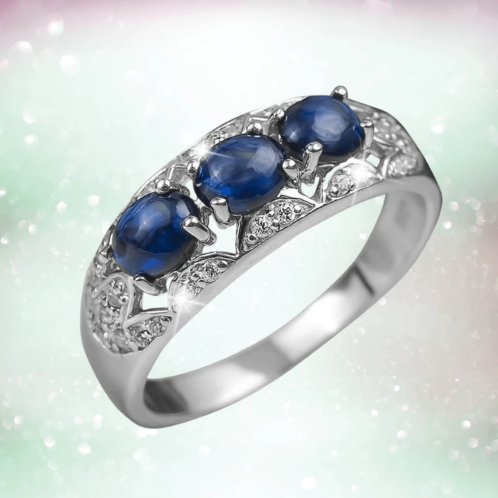 Berry Sapphire Ring featuring three deep blue sapphire stones set in sterling silver with rhodium plating, designed for female jewelry enthusiasts.