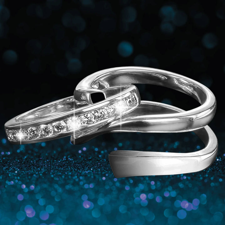 Twister Rhodium Ring for women made of sterling silver with rhodium plating, featuring a sleek twisted design adorned with sparkling clear stones, elegant jewelry piece.