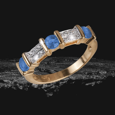 Trieste Sapphire Gem Ring features sterling silver with gold plating, adorned with blue sapphire and clear gemstones, designed for women’s elegant jewelry collection.