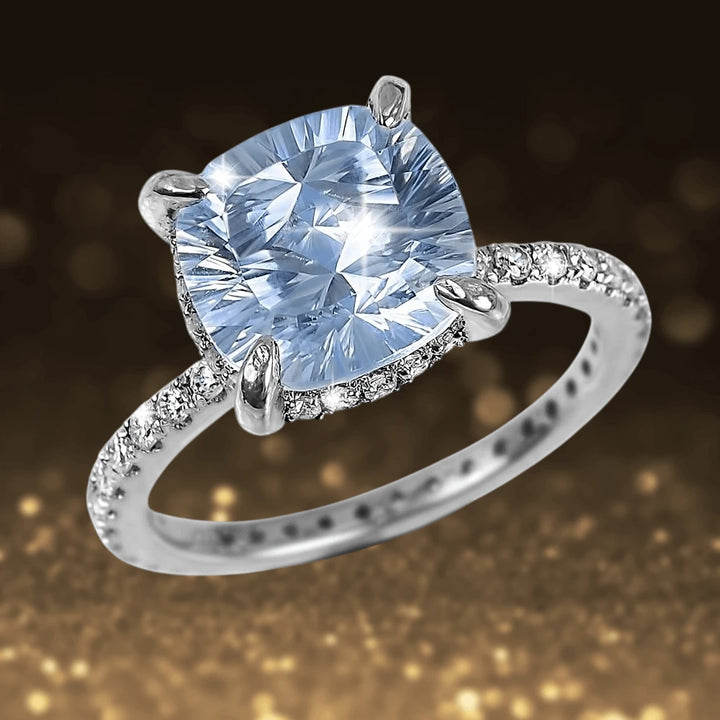 Trillion Topaz Ring featuring a dazzling trillion-cut topaz set in rhodium-plated sterling silver with a band adorned by sparkling accent stones, designed for women.