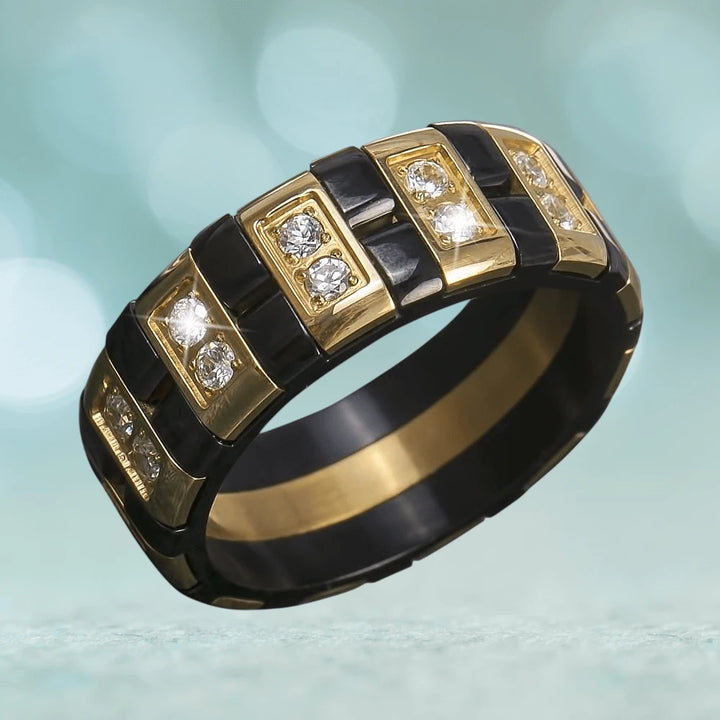Trident Men's Ring crafted from stainless steel with gold plating, featuring alternating black and gold sections adorned with clear gemstones for a bold and stylish jewelry piece.