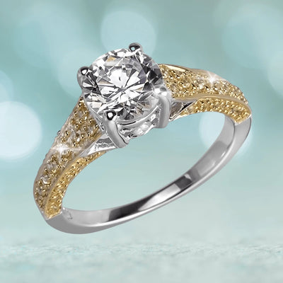Davina Ring featuring a two-tone sterling silver band with gold plating and a large round clear gemstone centerpiece, designed for women’s jewelry collection.