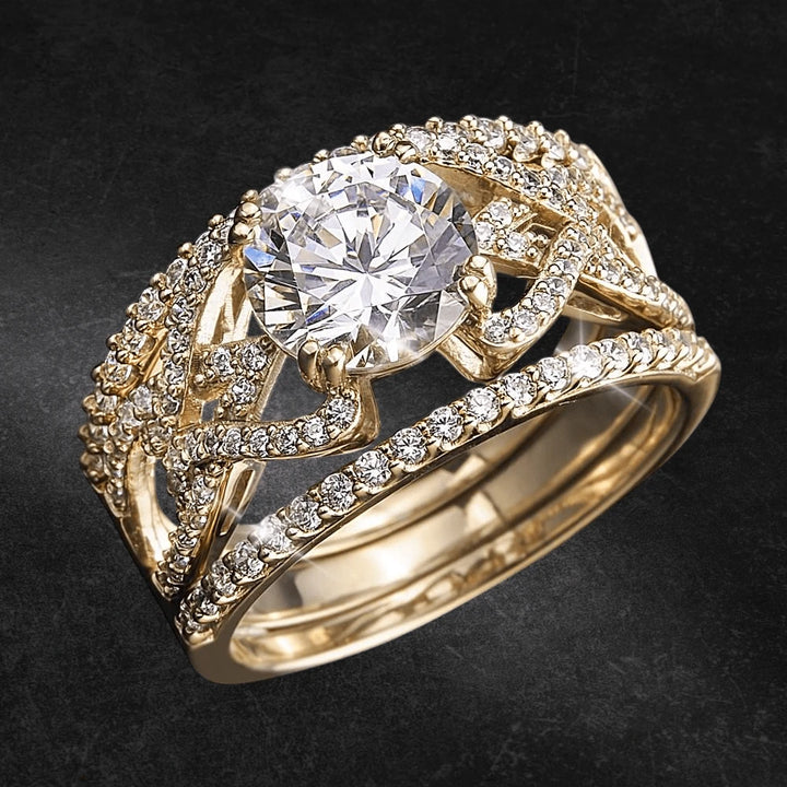Golden Luna Ring featuring a sterling silver base plated in gold, adorned with a central round-cut clear stone and encrusted with smaller sparkling stones, designed for women’s jewelry.