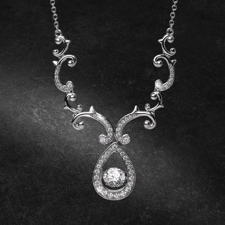 Rococo Dancing Necklace in sterling silver with rhodium plating, featuring intricate scrollwork and a central sparkling pendant, designed for females seeking elegant jewelry.