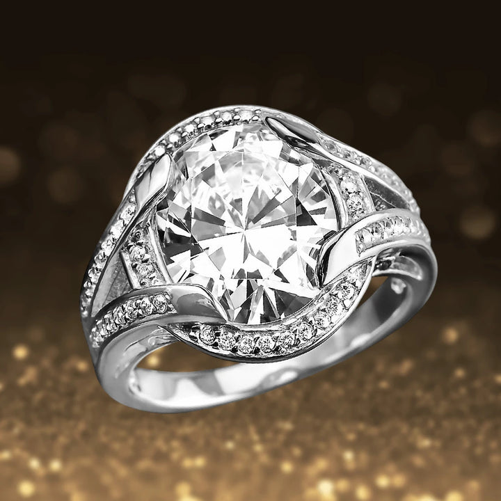 Valentina Ring featuring a sterling silver band with gold plating, adorned with a large central clear gemstone surrounded by smaller sparkling accents, designed for women’s jewelry.