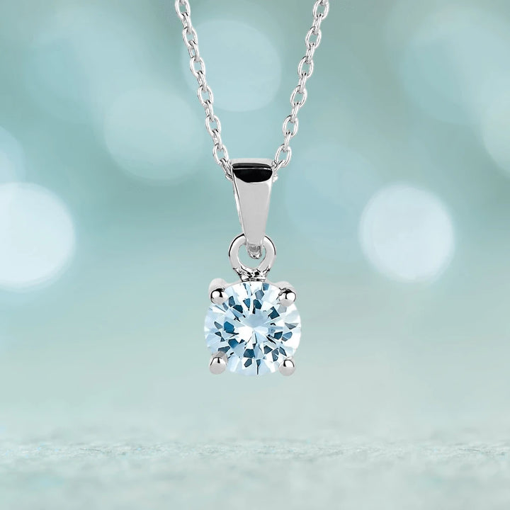 Brilliant Birthstones Pendant March featuring a sterling silver rhodium-plated chain with a sparkling light blue gemstone, elegantly designed for women’s jewelry collections.