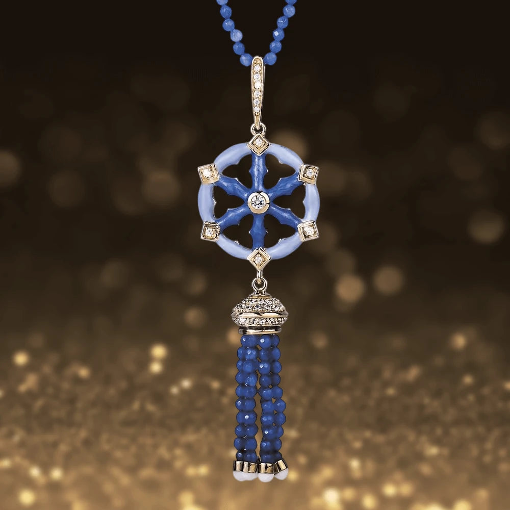 Marina Pendant featuring sterling silver with gold plating, adorned with blue beads and sparkling accents, designed as a stylish necklace for women’s jewelry collections.