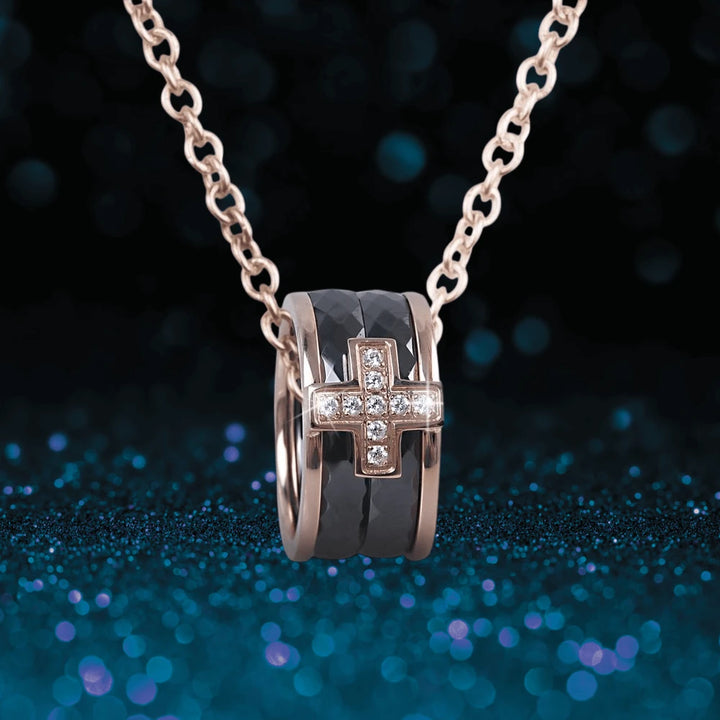 Ceramica Cross Pendant featuring a stainless steel black ceramic band with a rose gold plated cross adorned with clear crystals, designed for men on a matching rose gold chain.