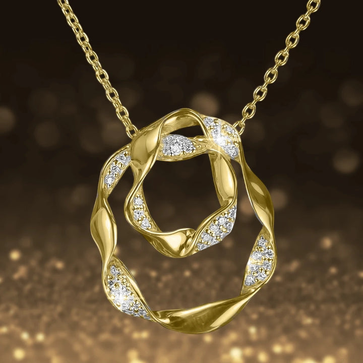 Ribbon Pendant featuring a gold-plated sterling silver design with sparkling accents on an elegant chain, perfect jewelry for women.