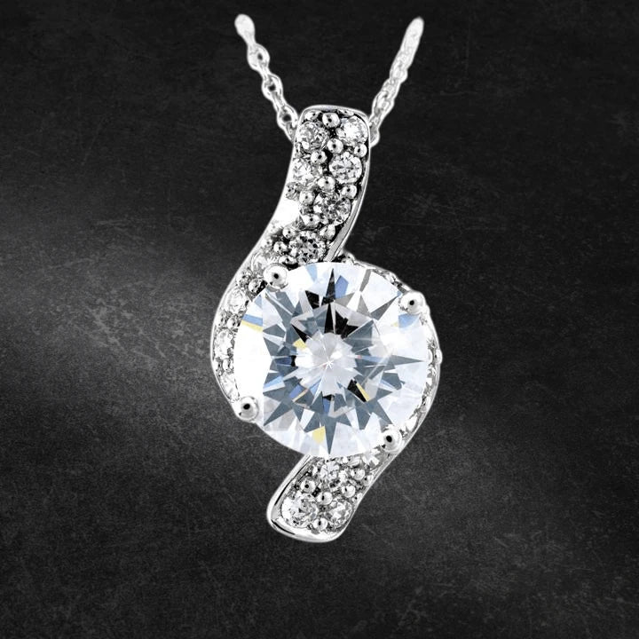 Sterling Silver Sonata Pendant featuring a large sparkling center stone surrounded by smaller accent stones on a delicate chain, designed for women’s jewelry collections.