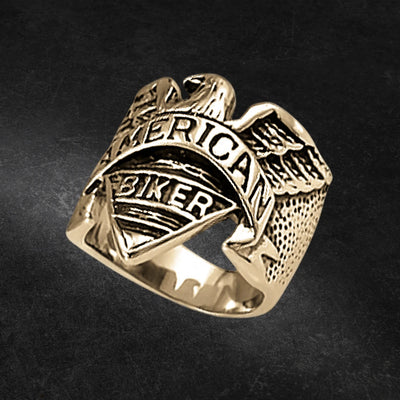 Eagle Rider Ring crafted from gold-plated stainless steel, featuring a detailed eagle design and engraved with "American Biker," a bold men's statement jewelry ring.