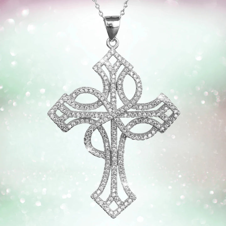Eulalia Rhodium Cross pendant for females crafted from sterling silver with rhodium plating, featuring intricate openwork and sparkling detail on a delicate chain.