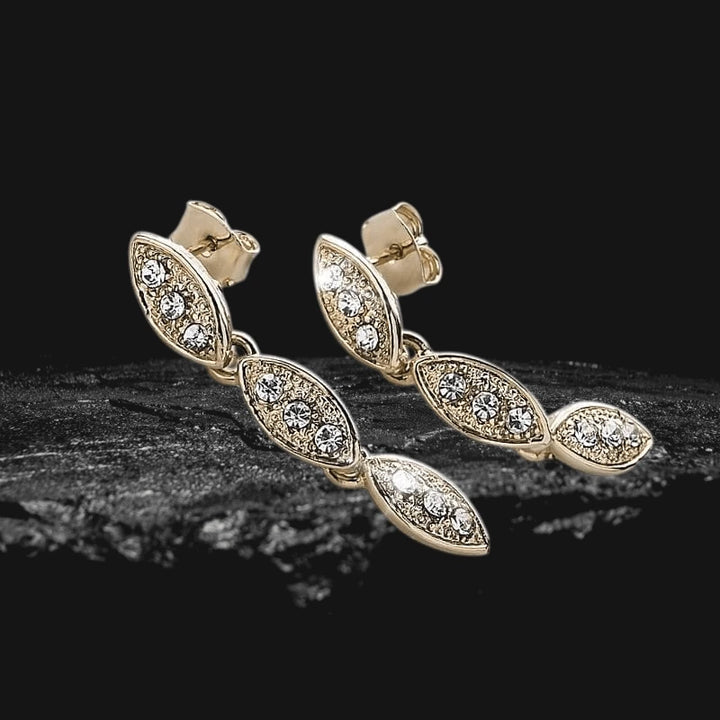 Captivating Leaf Earrings crafted in sterling silver with gold plating, featuring a delicate leaf design adorned with sparkling crystals for elegant women's jewelry.