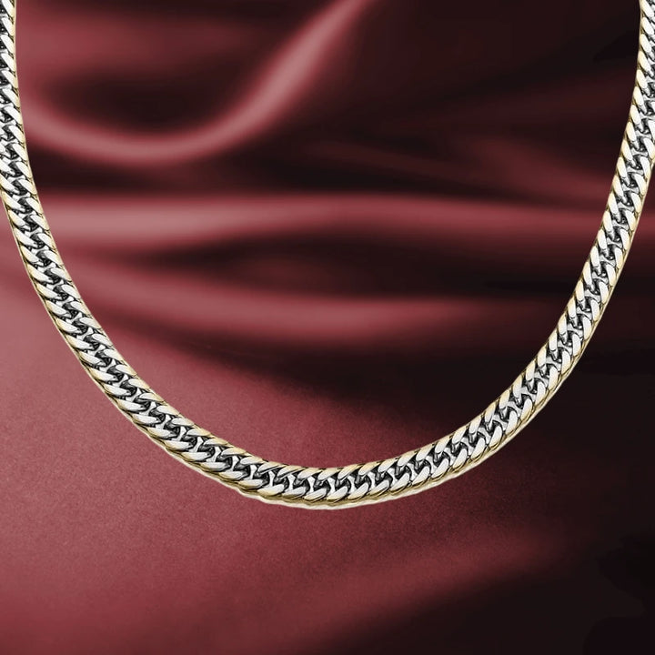Double Curb Gold Edged Necklace for men featuring a sleek curb chain design with gold edges, elegantly displayed on a rich maroon fabric background.