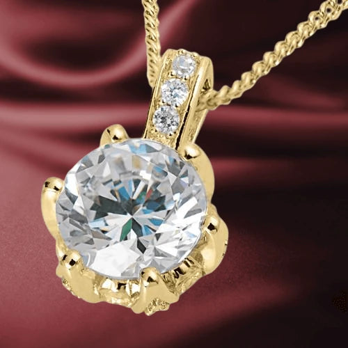 Gold Lotus Pendant featuring a large round clear gemstone set in gold-plated sterling silver with three small accent stones on the bail, designed for women.