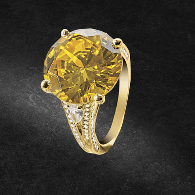 Golden Sun-Drop Ring featuring a large yellow gemstone set in sterling silver with gold plating, designed for women’s elegant jewelry collection.