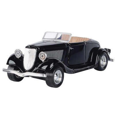 Black vintage convertible car with a glossy finish tan seats rounded fenders chrome grille headlights and bumpers isolated on a white background