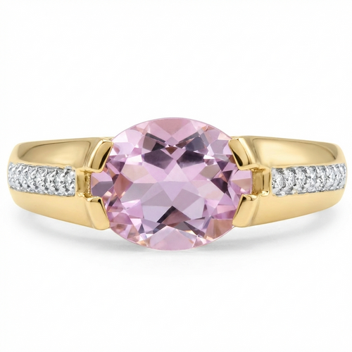Gold ring with a pink gemstone and diamond accents on a white background