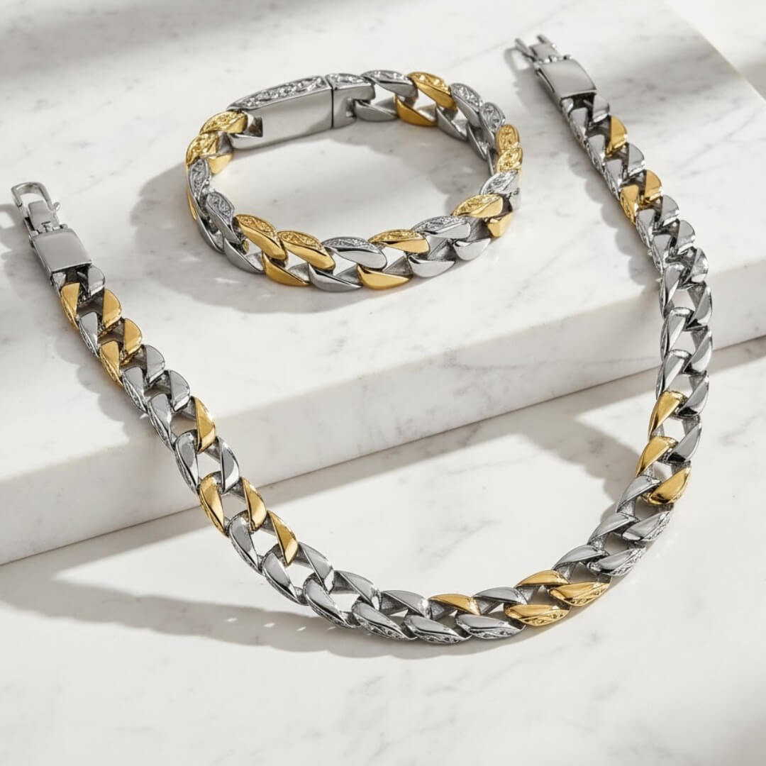 Two-tone silver and gold chain necklace and bracelet on a light . Curb Vine Men's Set by Daniel Steigerbackground