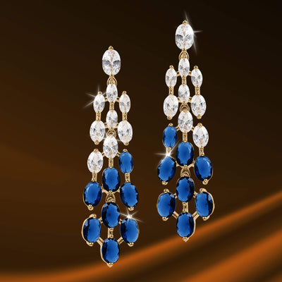 Elegant Royal Tide Earrings featuring cascading clear and deep blue gemstones set in gold-tone metal for a sophisticated jewelry statement.