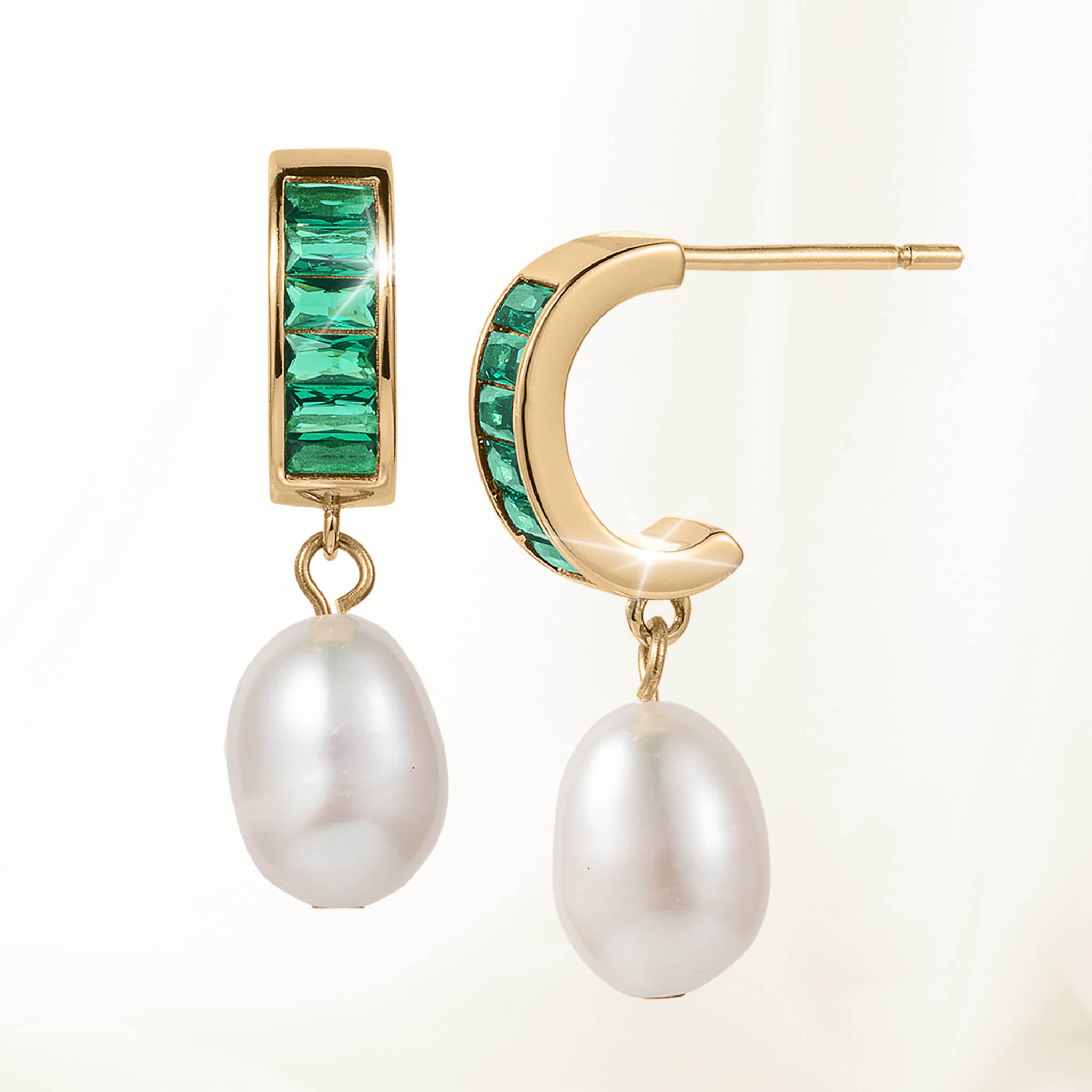 Pearl Radiance Earrings featuring gold-tone hoops with square-cut green gemstones and teardrop-shaped white pearls dangling below.