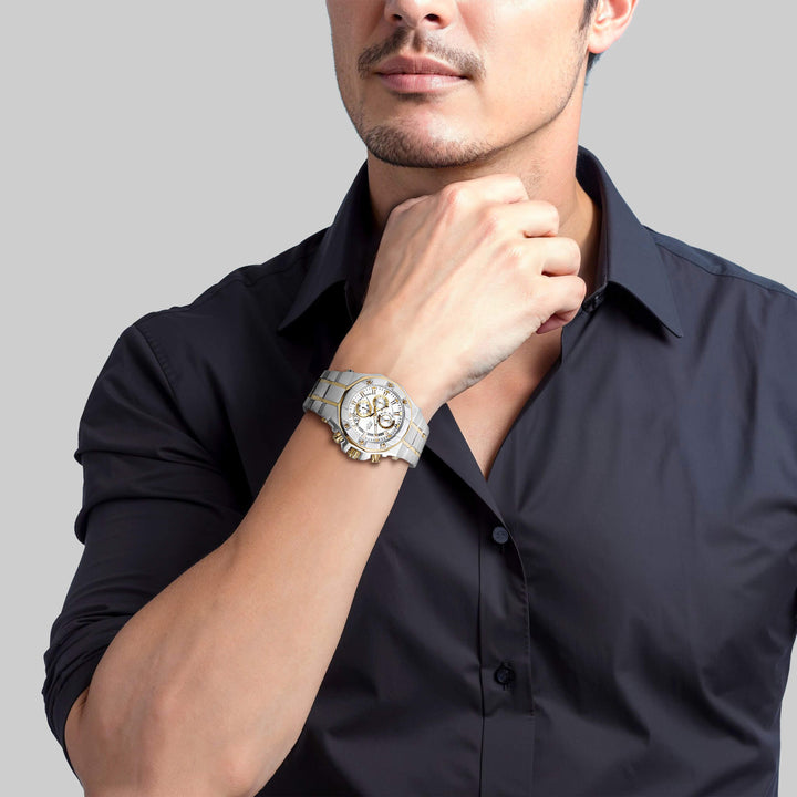 Man wearing a Phantom Two-Tone Men's Watch with a silver dial and stainless steel two-tone plating, styled with a black dress shirt for a sophisticated look.