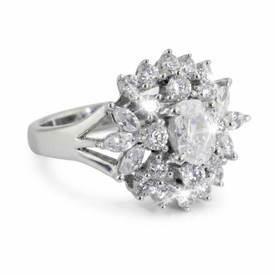 Sterling Silver Cluster Ring for female with an intricate design featuring a large central oval gemstone surrounded by multiple smaller round and marquise-shaped stones in a sparkling arrangement.