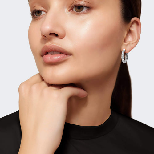 Woman wearing silver earrings