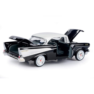 1957 Chevy Bel Air - Black model car with open doors, hood, and trunk showcasing detailed interior and classic two-tone black and white exterior finish.