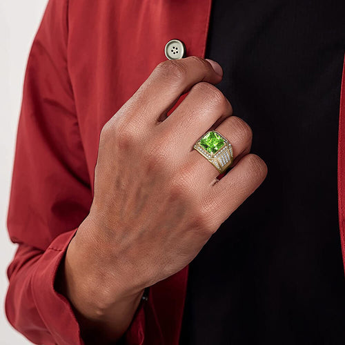 Gold ring with green stone on man&