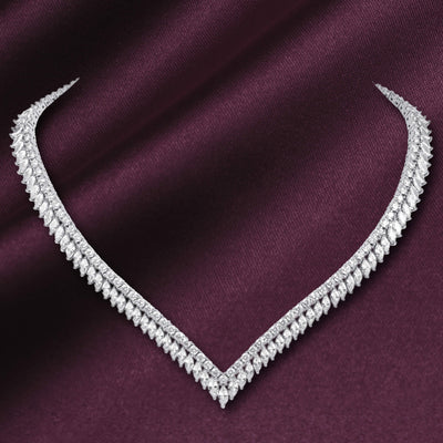 Crystal Cascade Necklace featuring a sparkling silver tone V shaped design with layered crystal accents on burgundy fabric Up To 75% Off Retail