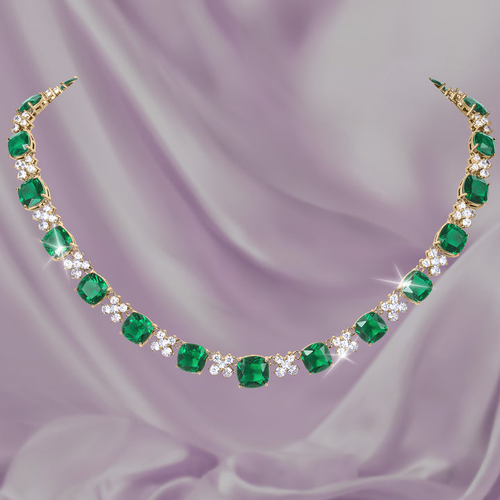 Freya Collection emerald green gemstone necklace with sparkling diamond accents displayed on lavender satin Up To 75% Off Retail