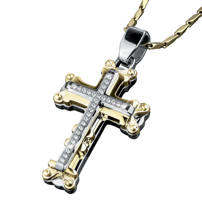 Goliath Steel Cross Pendant in stainless steel with two-tone plating, featuring embedded clear stones on a masculine cross design with gold and silver accents.