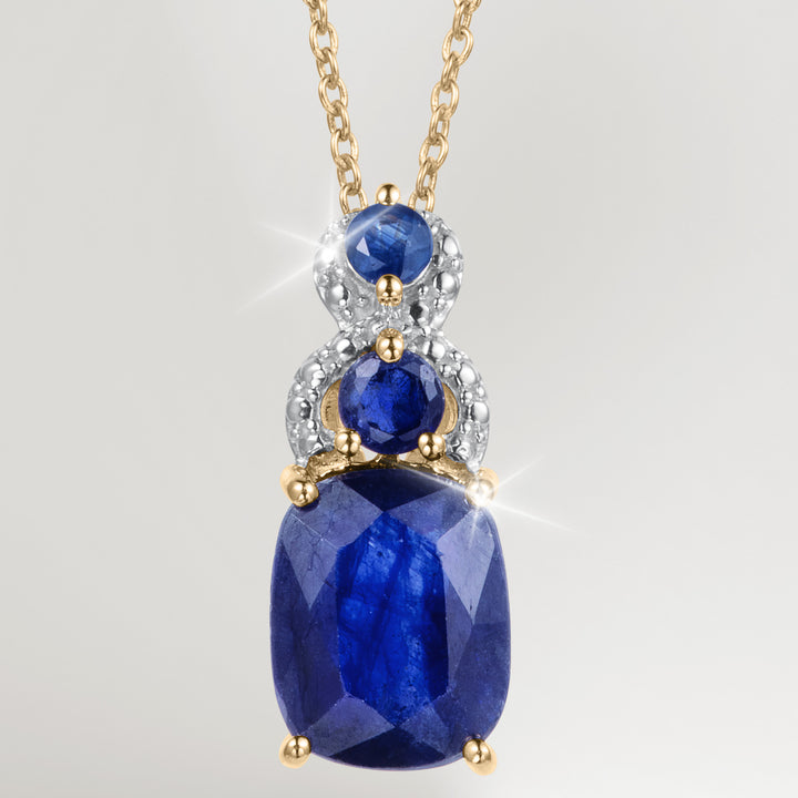 Elara Sapphire Pendant featuring faceted blue sapphire gemstones in a gold tone setting with sparkling accents on a delicate chain Up To 75% Off Retail