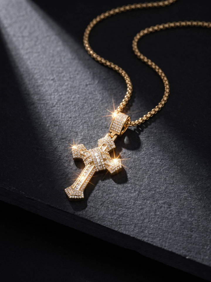 Redemption Pendant gold cross necklace with sparkling crystal details and a textured chain displayed on black fabric for a bold elegant jewelry statement