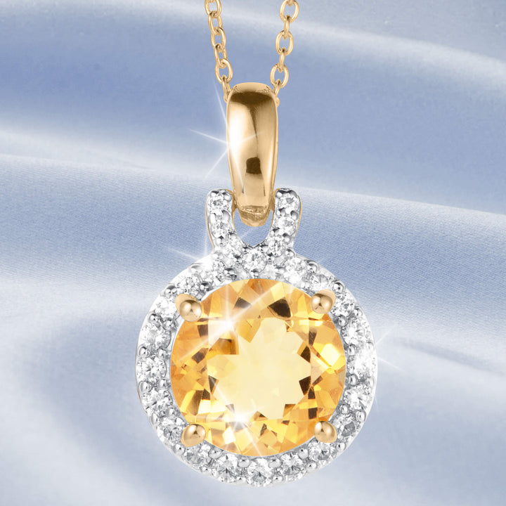 Golden Glow Citrine Pendant with a radiant round golden gemstone surrounded by sparkling clear stones on a polished gold chain for elegant jewelry styling